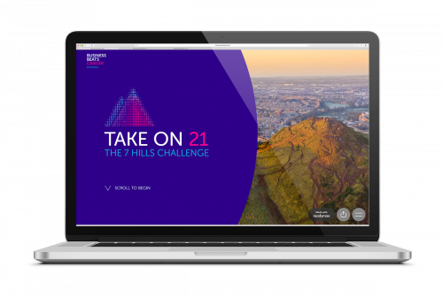 Image of a laptop with Take On 21 website on the screen